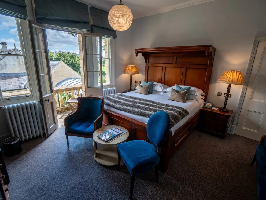 Bedroom with balcony and pool view